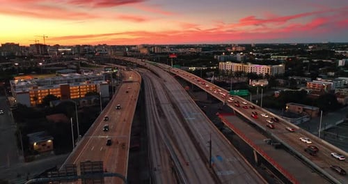 Few multi-lane roads on the freeways with cars moving by.