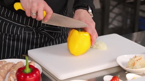 Close up of a Cook Slicing Bell Pepper