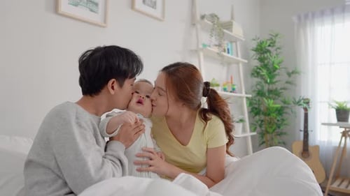 Loving Family With Baby Enjoying Time Together