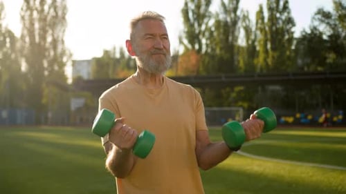 Old Caucasian Man Grandfather Lift Dumbbell Pump Biceps Sport Athlete Stadium Outside Sportsman