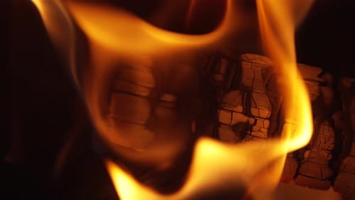 Burning Fireplace Logs Creating Warmth and Cozy Atmosphere