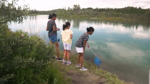 Family Enjoys Time Together at a Quiet Lake