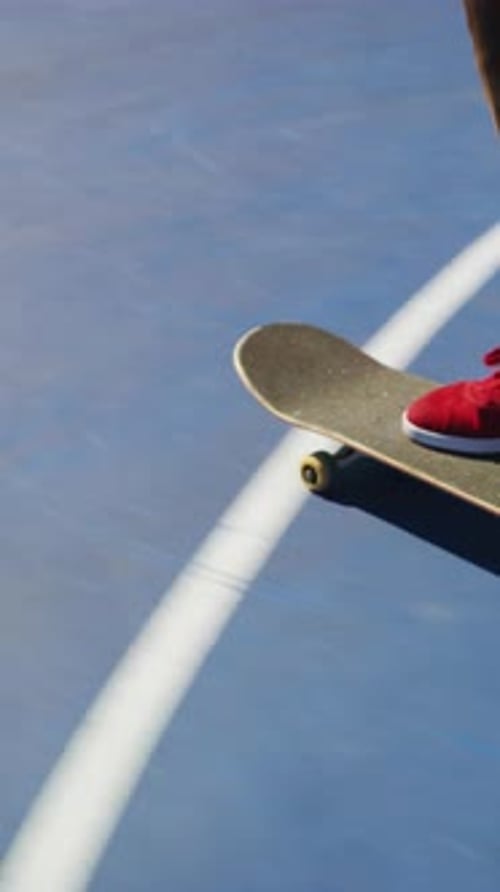 Skateboarding, trick and legs on court with action, stability control and riding technique