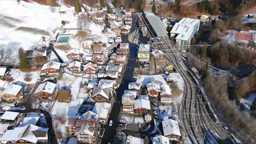 Beautiful Snowy Alpine Village Nestled in a Quiet Winter Mountain Valley