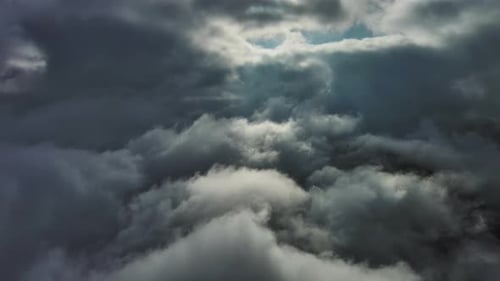 Aerial High View of Dramatic Clouds Flying