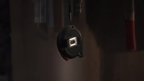 Tape Measure Swinging Slowly in Workshop Media