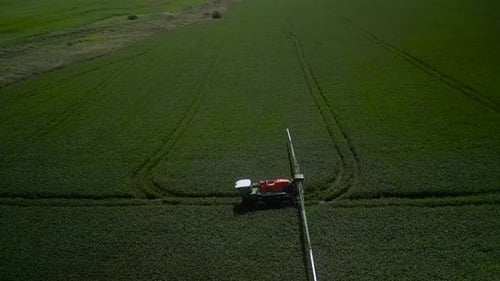 Spray Fertilize On Field With Chemicals In Agriculture Field