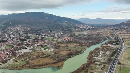 Aerial View Mtskheta's Cathedral Standing Guard Over Ancient Waters