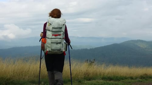 Girl Hiker Walking By The Grassy Mountain Hill 6