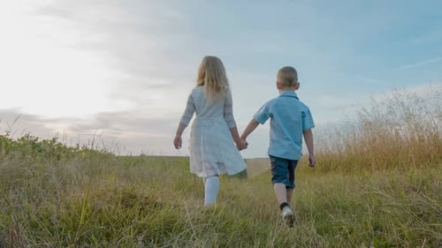Two Happy Children Playing on the Road at the Day Time