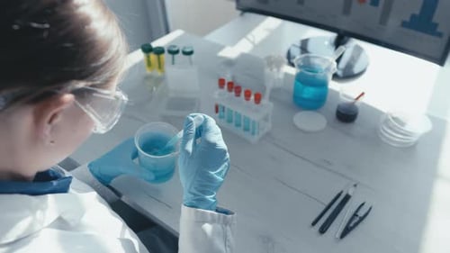 Female Scientist Doing Science Experiment in Lab