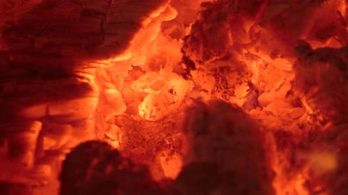 Glowing Embers Burning With Bright Orange Flames