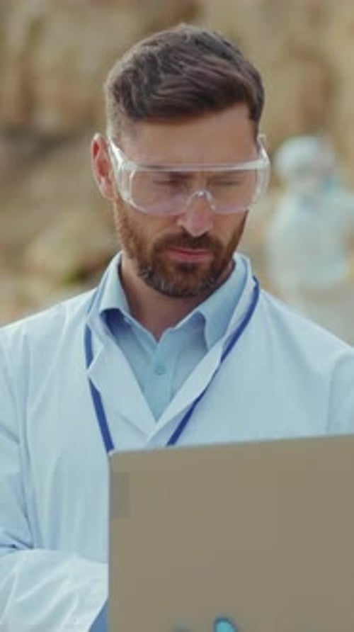 A Dedicated Scientist is Meticulously Analyzing Complex Data in a Hightech Laboratory Environment