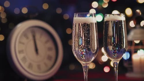 Champagne, Clock, and Christmas Lights New Year Celebration
