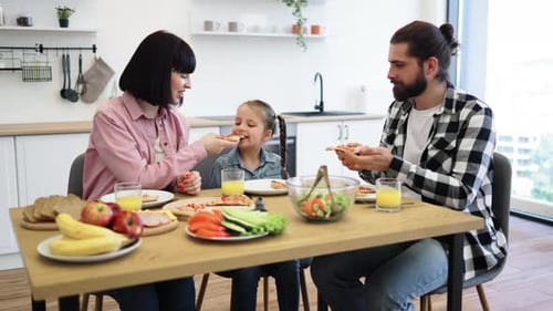 Family Enjoys Pizza and Healthy Food at Home