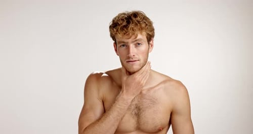 Face, shirtless and man with cosmetics, skincare and dermatology on studio background