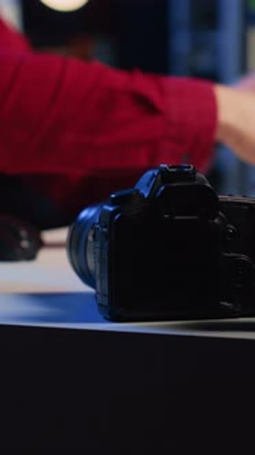 Adult Looks at Camera in a Dark Room