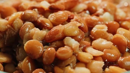 Lentils Macro Open Metal Can with Preserved Steamed Brown Lentils Close Up Isolated on White
