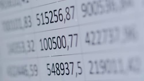 Finance Data Closeup of Financial Cash Flow Stocks Bitcoin Data on PC Screen Tax Report Year