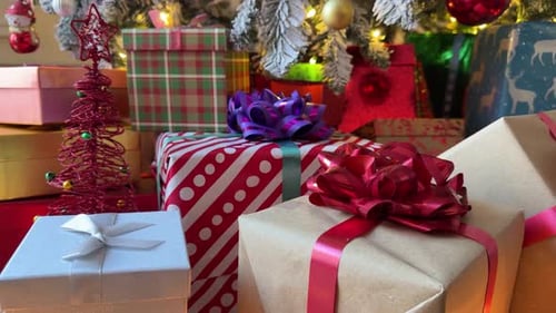 Festive Christmas Presents Under Decorated Tree