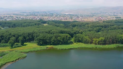 Aerial shot Lake near forest. Sevan lake in Armenia, Caucasus.