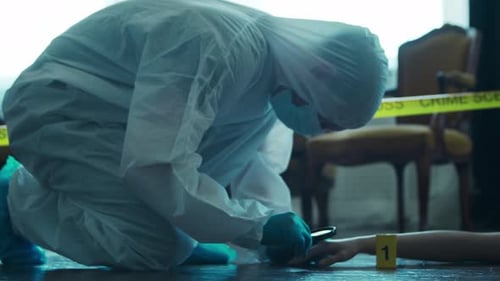 Forensic Investigator Examining Crime Scene Evidence