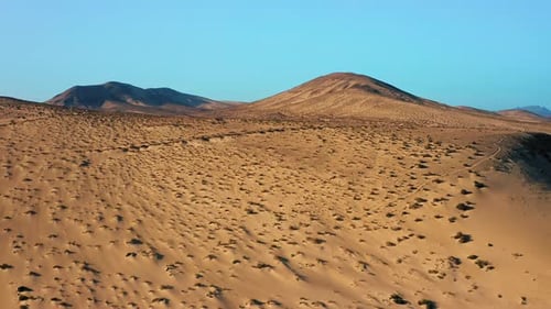 Aerial View Over Sand Desert and the Massive Rock Formations
