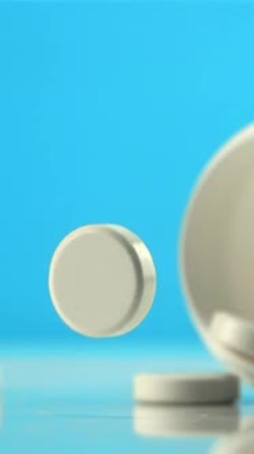 One Tablet Falls on the Table and Rotates Filmed is Slow Motion 1000 Fps