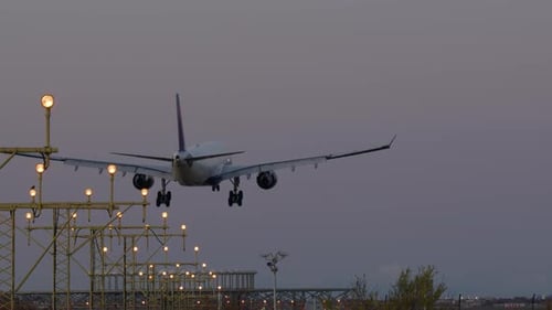 Airplane Landing at Twilight
