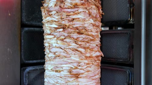 Large Turkish Doner skewer spinning in a local restaurant