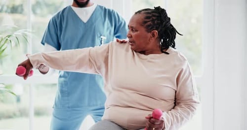 Physiotherapy, arm and dumbbell with a black woman in a clinic for rehabilitation