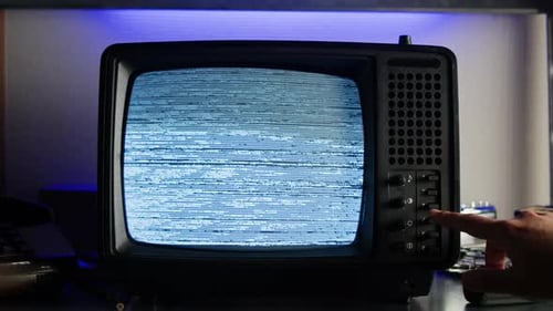 Vintage TV with Static Screen and Button Pressing