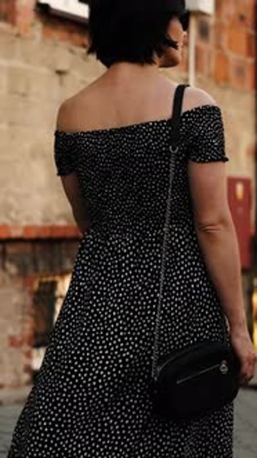 Attractive Young Woman Walking In Historical Part Of European City