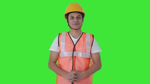 Happy Indian construction labour smiling to the camera Green screen