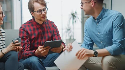 Coworkers Discussing Business Plans in Office Meeting