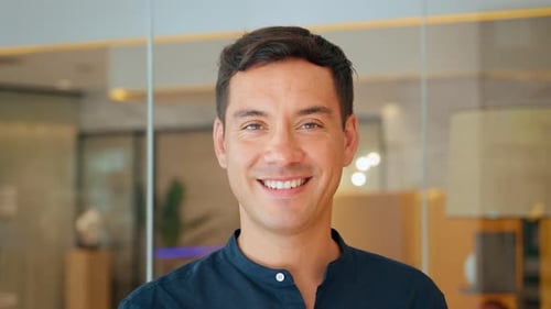 Happy Young Business Man Manager Standing in Office Close Up Portrait