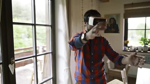 Man Indoors Using Virtual Reality Headset