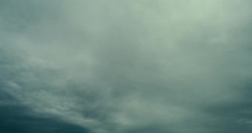 Turbulent Clouds Moving in Blue-Green Sky Time Lapse