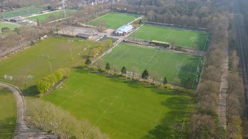 Aerial of amateur sports club with green soccer fields
