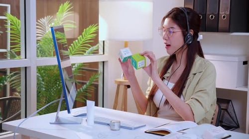 Young asian creative woman development packaging cosmetic and skincare product design with AI.