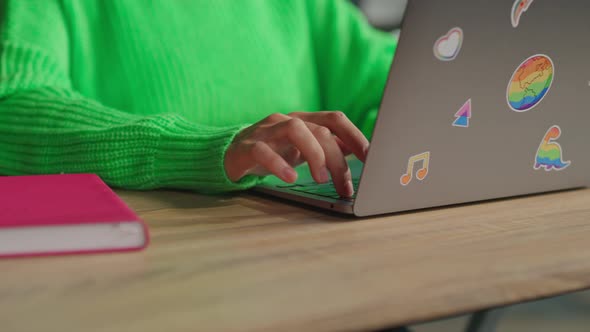 Female Hands Typing on Keyboard of Laptop with Lgbt Rainbow Stickers in ...