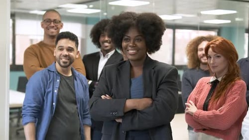 Contented Manager Posing with Team in Creative Office