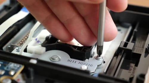 T88. During the repair of an electronic gadget, a screw is unscrewed with a screwdriver.