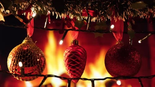 Christmas Ornaments Glowing With Fireplace Background