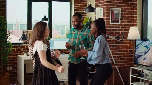 Cheerful Friends Dancing at Apartment Party Having Fun Together Doing Energetic Dance Moves