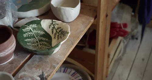 Pan of Ceramic Studio Shelves with Pottery