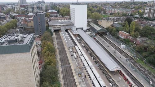 Drone Shot Over Ealing Broadway Station with Trains