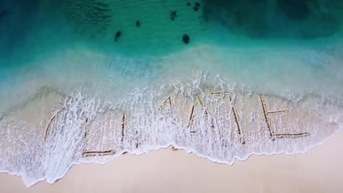 Climate message written in sand on beach