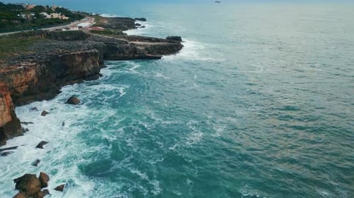 Drone View Rocky Seaside Scenery with Stormy Rough Sea Waves Breaking Coastline