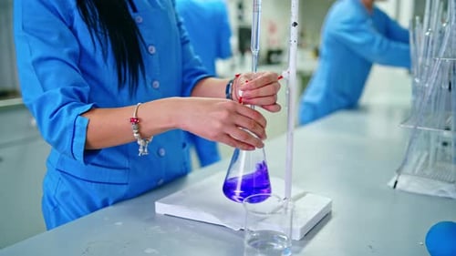 Person in Lab Coat Working in Laboratory